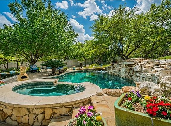 Fabulous back yard living.  Sparkling heated pool with 3 waterfalls and fountain.  Hot tub.  Fully landscaped.