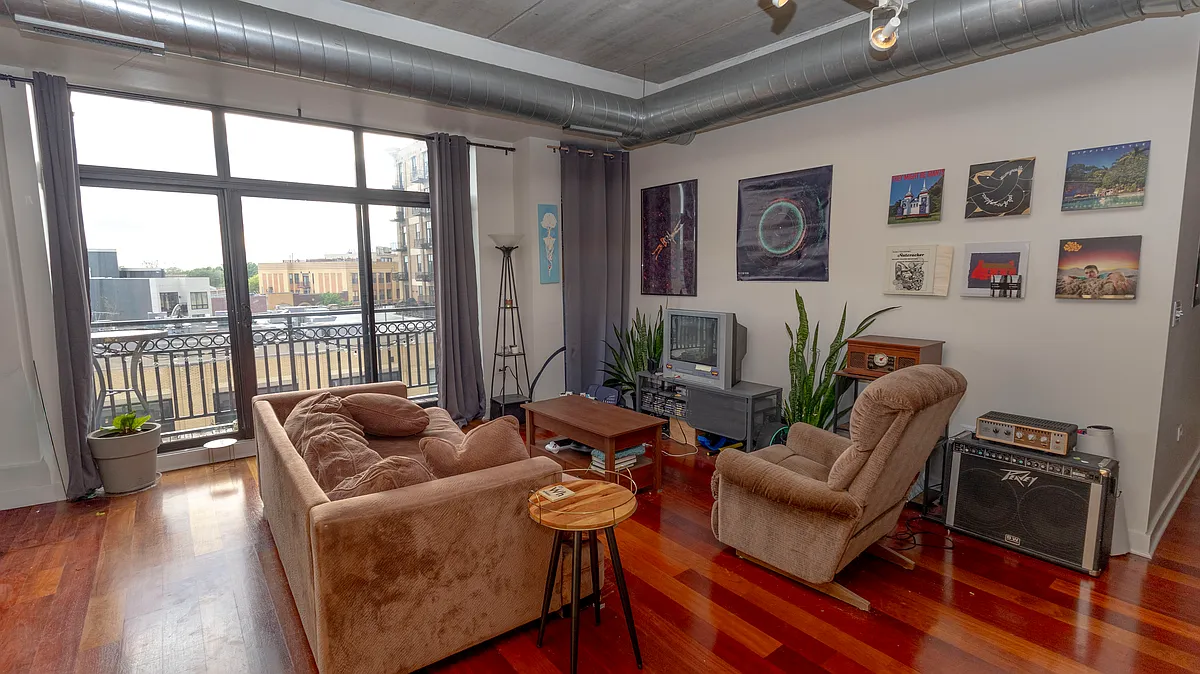 The spacious Living Area boasts South Western views - 3245 N Ashland Ave #5B