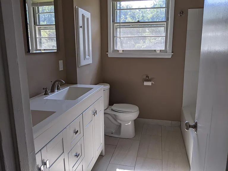 Remodeled bathroom w double sinks.