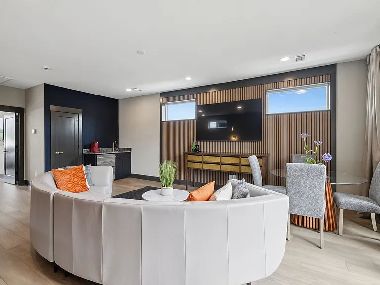 3rd floor living area opens to roof top balcony.