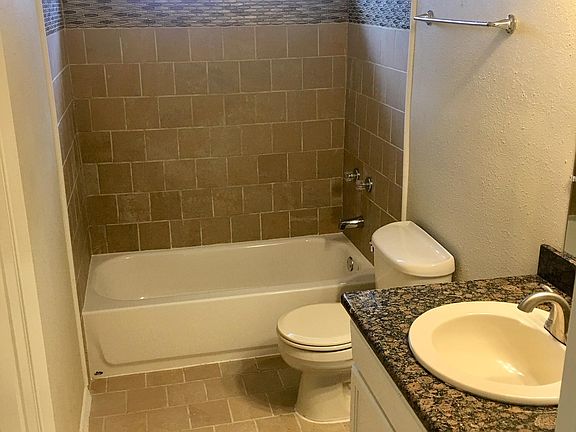Downstairs bathroom has been completely renovated. Granite countertop on vanity and decorative tile in shower.