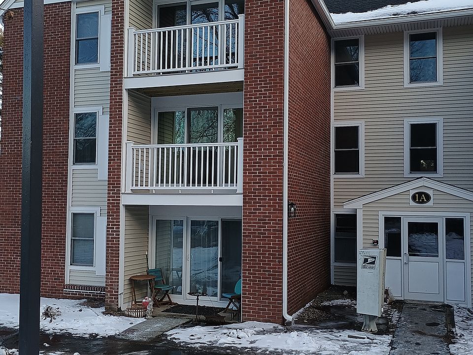 Entrance and third story balcony