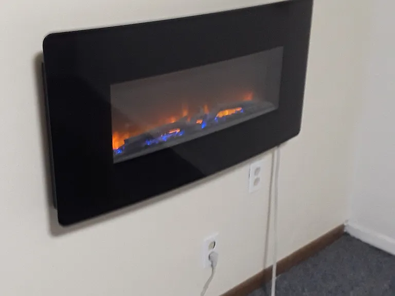 electric fireplace in basement bedroom