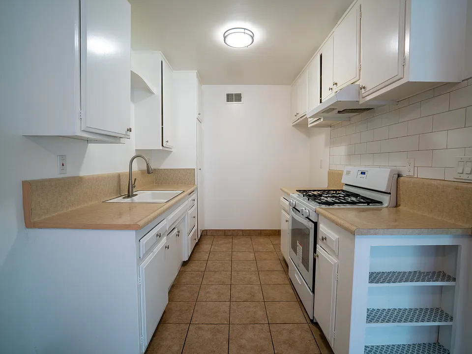 new counters and sink and faucet and with new refrigerator