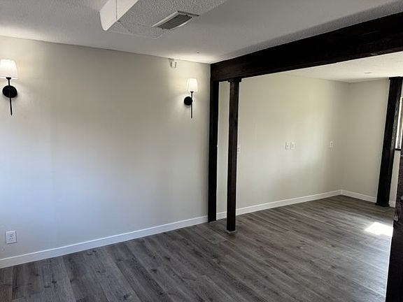 Open space (right) can be walled off to create a second bedroom upon request but has been left open at this time