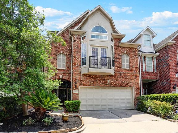 Handsome stucco & brick exterior plus petite balcony are so welcoming. Greet your guests at the pret