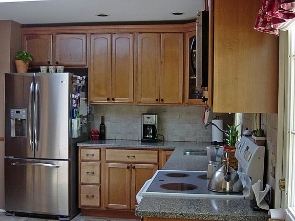 Granite Counters. Pine Cabinets, Glazed Tile Floors, Skylight