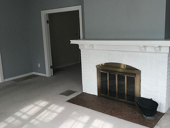 View of the living room with entry into the dining room to t
