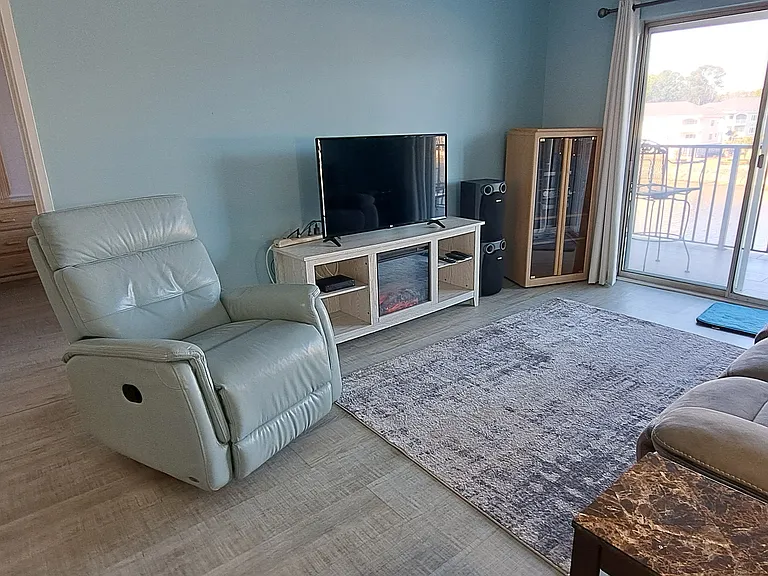 Living room separates the two bedrooms for privacy.