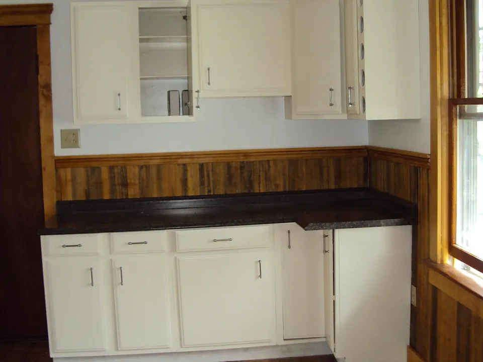 kitchen view with south facing window and chandelier
(white stove has been replaced, the new one is stainless)