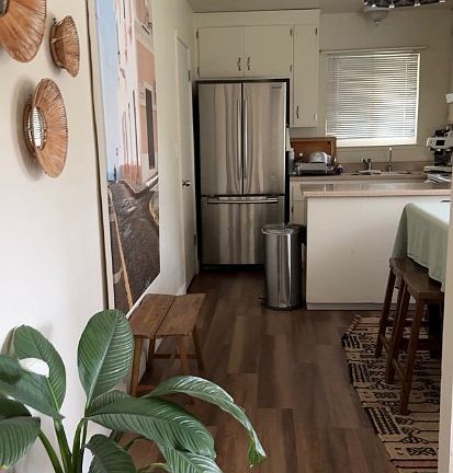 View of the kitchen and dining area as seen from the entry hall.