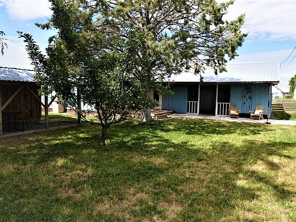 House sits on the north end of the property near the alley away from the street, which makes for a large front yard.