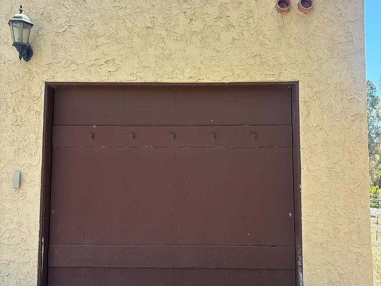 Automatic garage door with remote control available