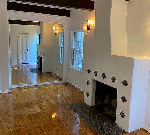 Charming tiled in fireplace with mirrored living room wall! Imagine your tree in the corner with the fireplace going and a wonderful glass of wine............ Welcome to Christmas, in your new abode