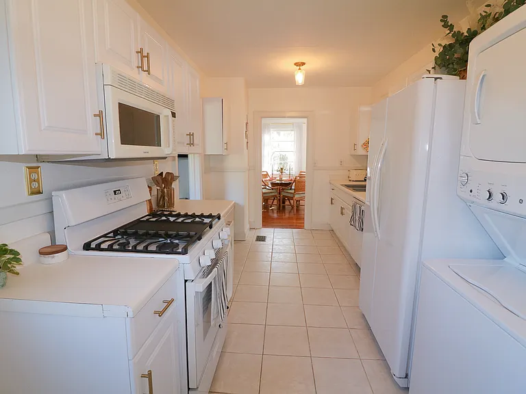 Large fully stocked kitchen with dishwasher, gas stove, oven, microwave, refrigirator/freezer. Includes small appliances such as air fryer and toaster oven