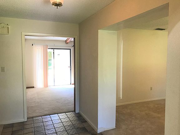 FOYER entry with FAMILY ROOM straight ahead and Living Room/