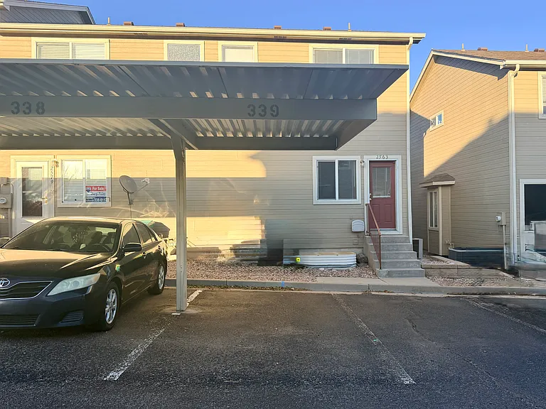 Reserved covered carport (#339) with nearby guest/open parking.