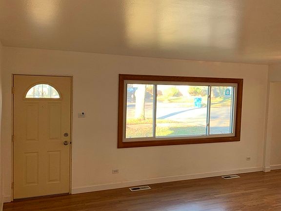 Spacious room with  newer upgraded wood laminate f