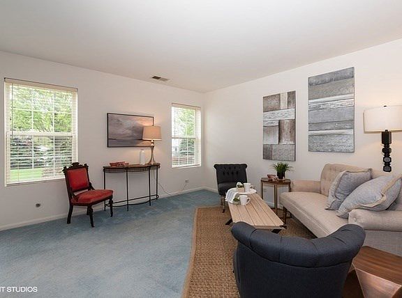 Cozy living room overlooking gorgeous green space