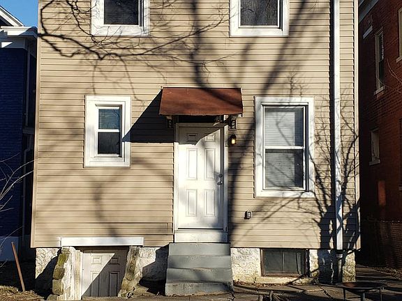 First floor rear entrance and basement access. Small paver patio.