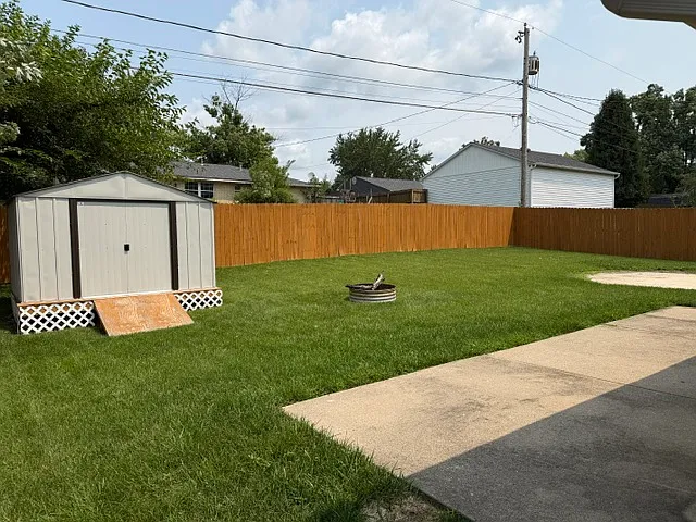 Fenced Backyard with nice shed and patio