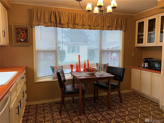 The cozy space by the window is perfect for a cafe table and a couple of chairs.