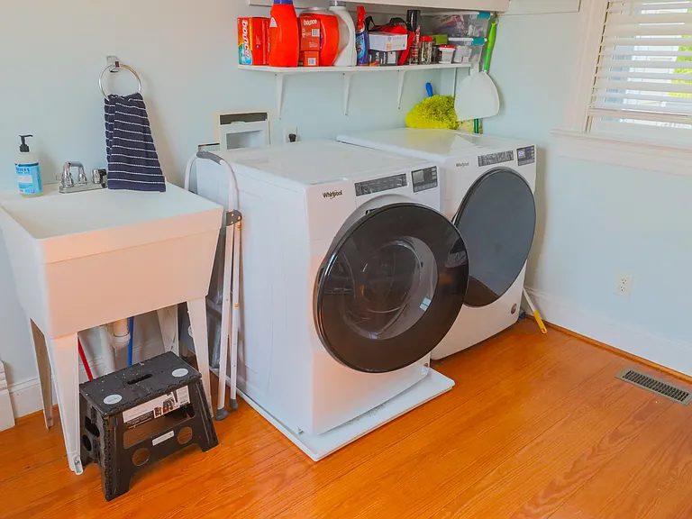 Laundry room located down stairs. New washer and dryer as well as utility sink.