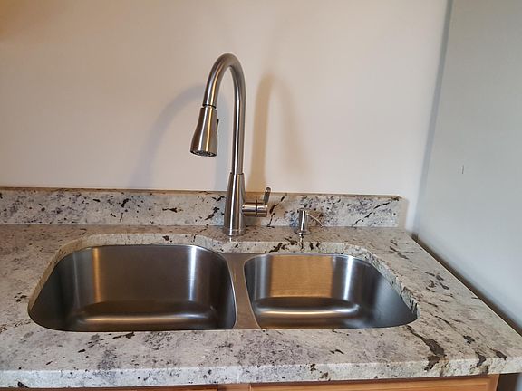 New under mount stainless sink.
