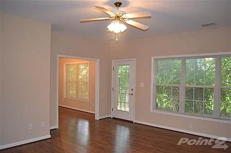 Living room opens to backyard and patio.