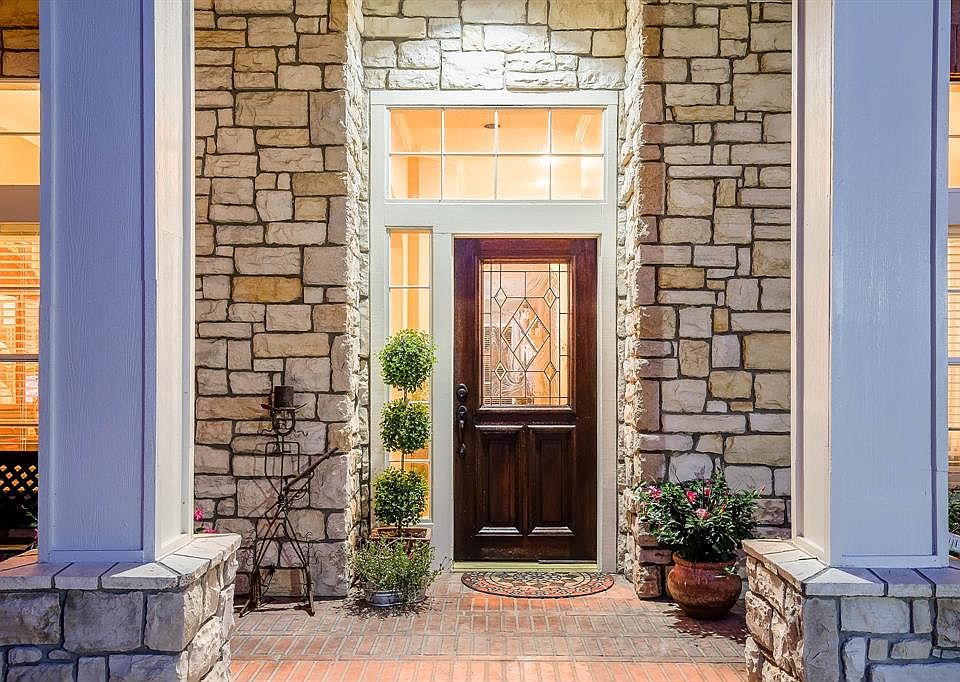 Inviting elevation with a wonderful front porch, ultra design stone and gorgeous front door.