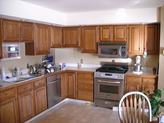 Kitchen Oak, Corian and Stainless Steel
