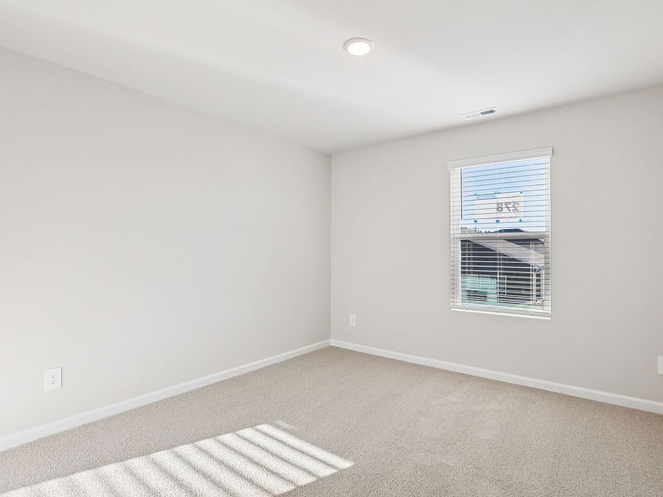 Secondary bedroom in the Johnson floorplan at a Meritage Homes community in Garner, NC.