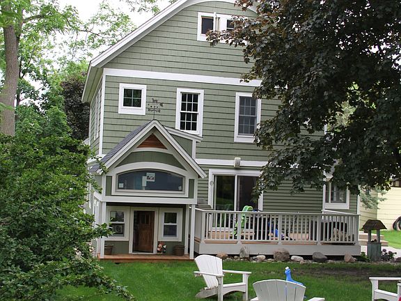view of back yard, fire pit and deck area