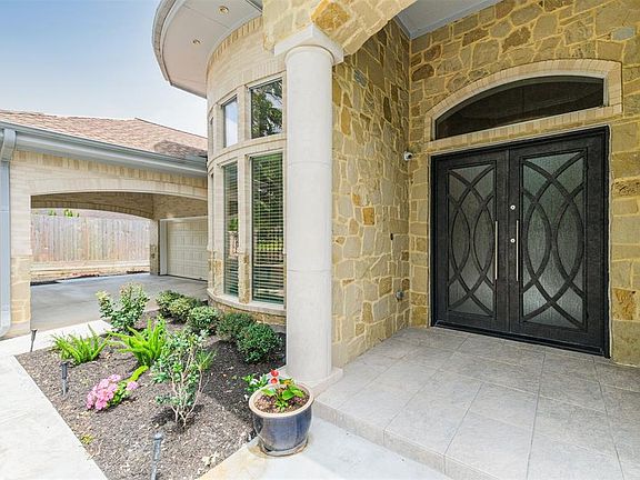 Custom made metal double doors greet your guests