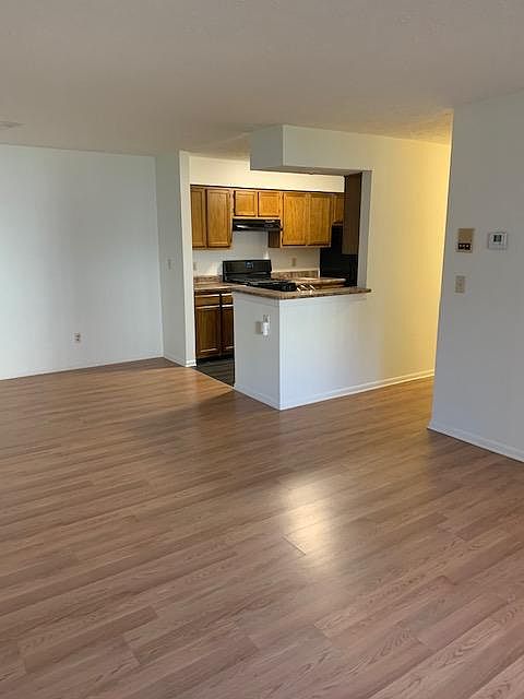 Living room looking in to galley style kitchen