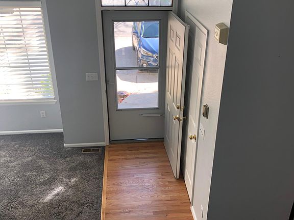 View from top of stairs down to entrance of the unit.