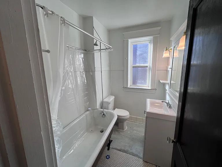 Unwind in the soaking tub, a distinctive feature that adds elegance and old-world charm to your daily routine.