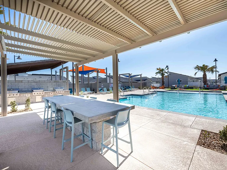 Experience upscale outdoor living with this stunning poolside retreat.