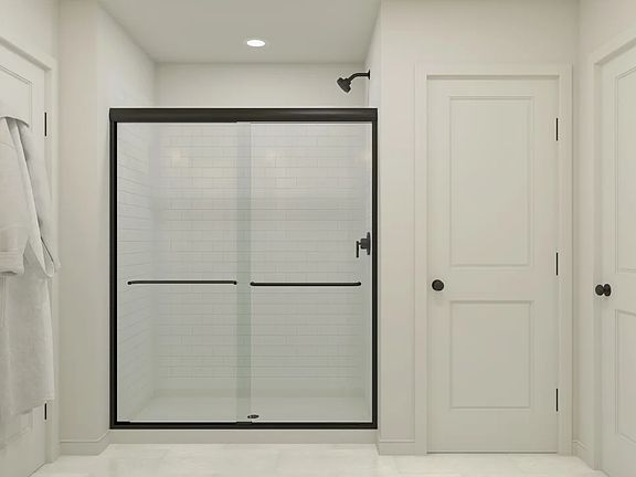 Primary bath with matte black shower enclosure