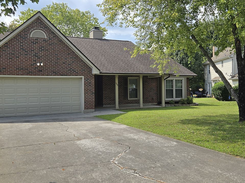 Front of house with covered front patio.