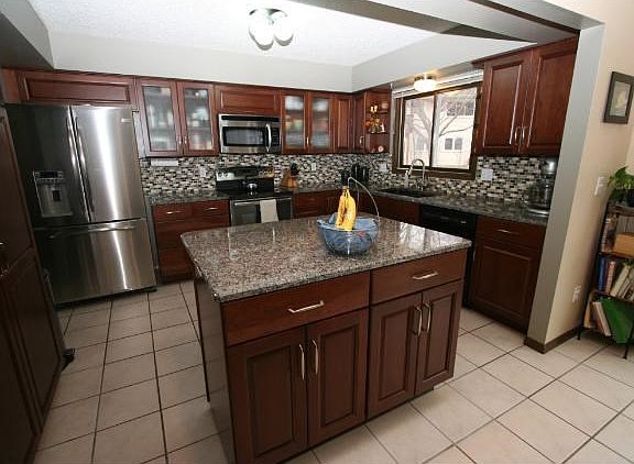 Amazing NEW kitchen w/ spacious island, new cabinets, SS appliances and granite countertops.