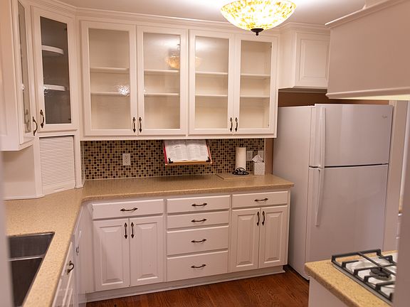 Kitchen cabinets glass tile back splash custom cabinets with upper and lower storage space