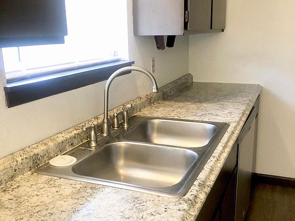 New counter tops. Modern faucet.