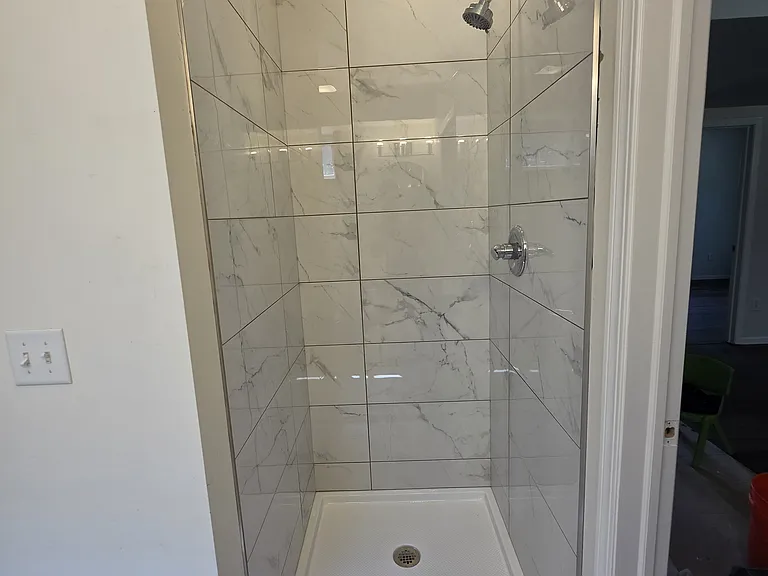 walk-in shower in the lower level bathroom