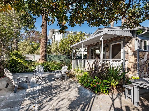 On a serene, secluded Walk Street surrounded by beautiful trees, landscaping and even a huge Eureka lemon tree!