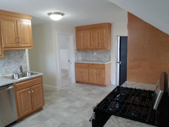 Kitchen showing extra cabinetry across room for more storage