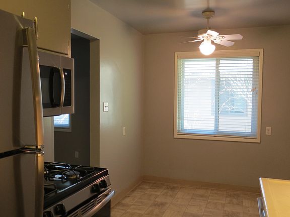 Dining area in kitchen showing door to living room.