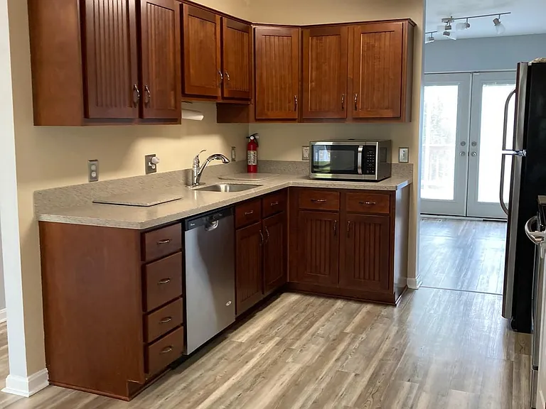 Kitchen with microwave and dish washer plus garbage disposal