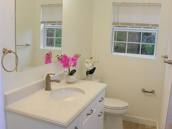 Renovated bathroom with brand new vanity, fresh paint on walls