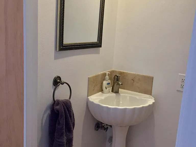 Half bath on main floor between kitchen and living room